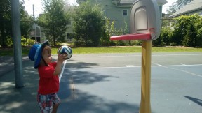 This little hoop is just his size... he can even dunk!